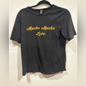Black tee with gold embroidered lettering